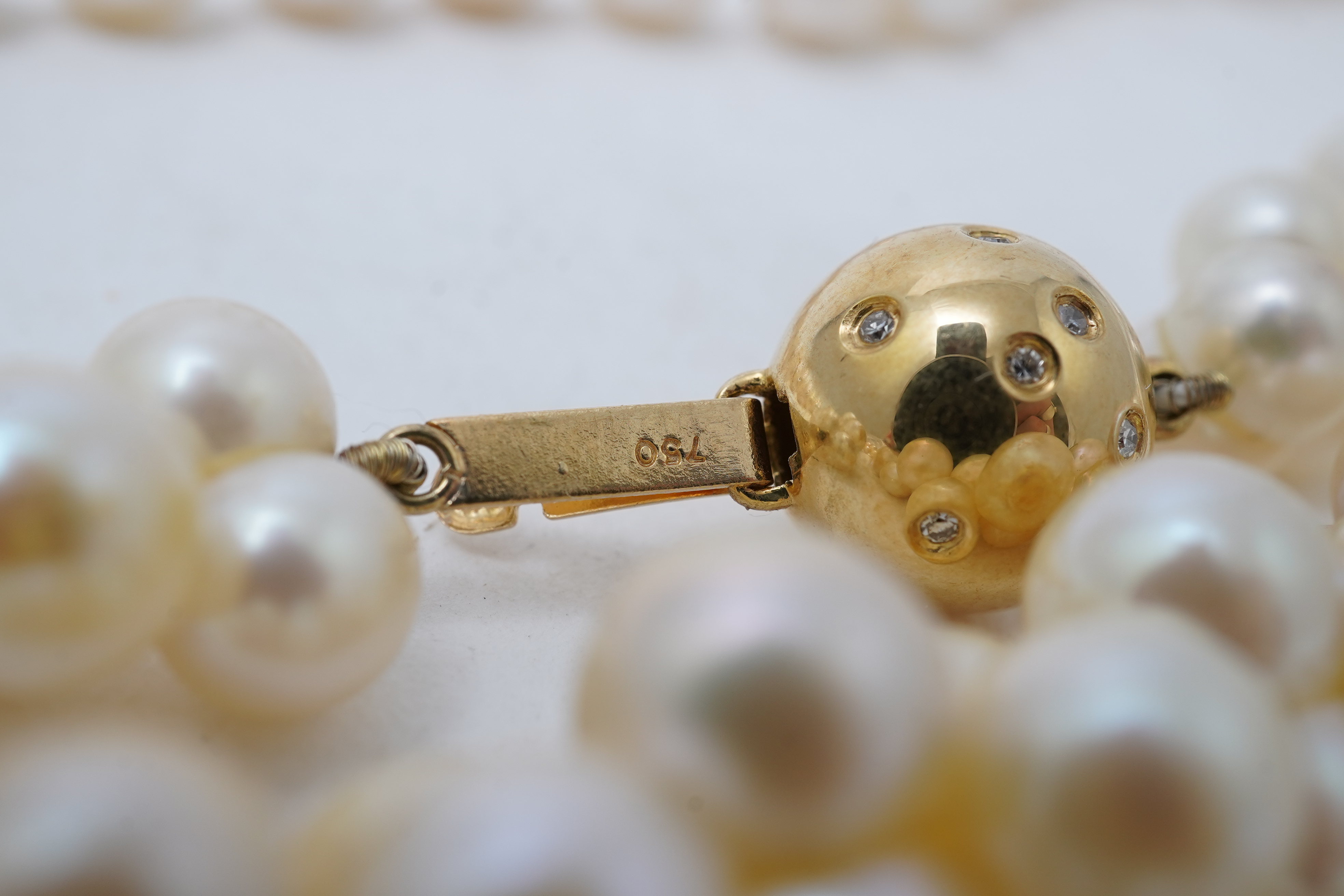 A collection of four cultured pearl necklaces